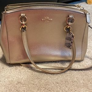 Gold metallic coach purse with snake skin print